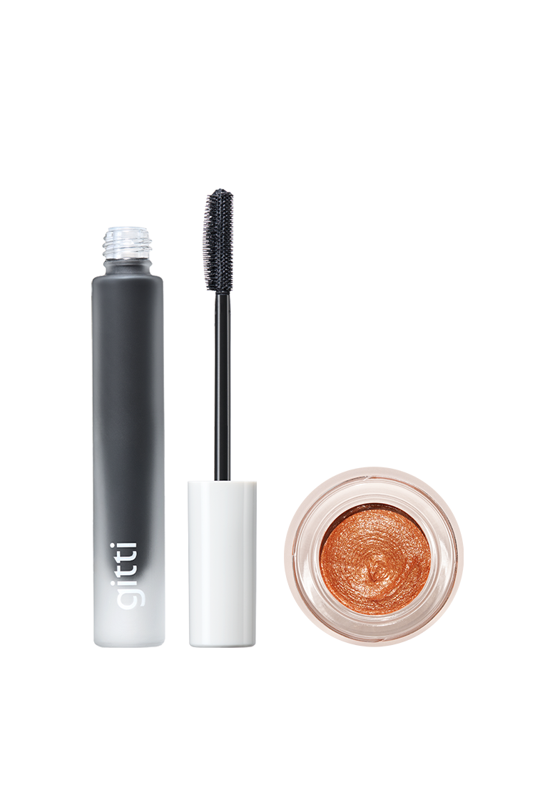 Das Cheek & Lash Duo besteht aus einer Tube schwarzer Wimperntusche mit Applikator und einem offenen Tiegel mit schimmerndem Bronzelidschatten - das perfekte Set für strahlende Augen und definierte Wimpern.