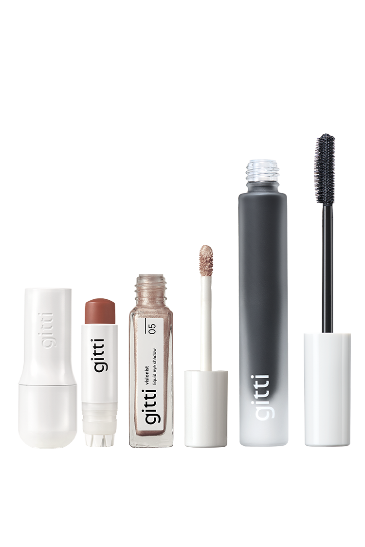 Das Celebration Trio besteht aus einem cremefarbenen Rouge-Stift, einem flüssigen Visionist Lidschatten mit Applikator und einer schwarzen Wimperntusche mit Zauberstab - alles in einer minimalistischen Gitti-Verpackung.