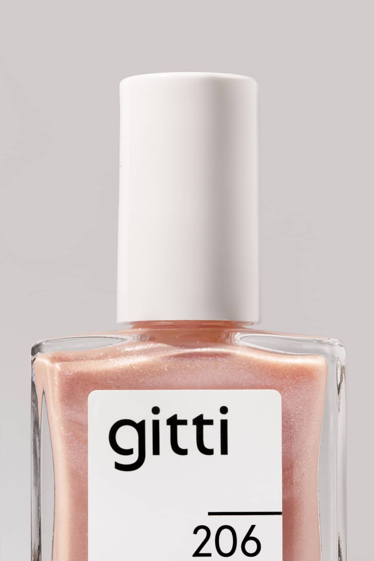 Eine Flasche gitti no. 206 Nagellack in einem perlrosa Farbton mit weißer Kappe und einem teilweise sichtbaren Etikett - ein echter Bestseller.
