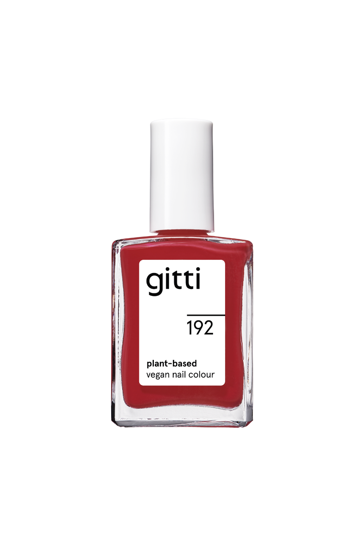 Eine Klarglasflasche mit gitti no. 192 pflanzlicher veganer Nagelfarbe in leuchtendes Rot, mit weißem Verschluss und Etikett.