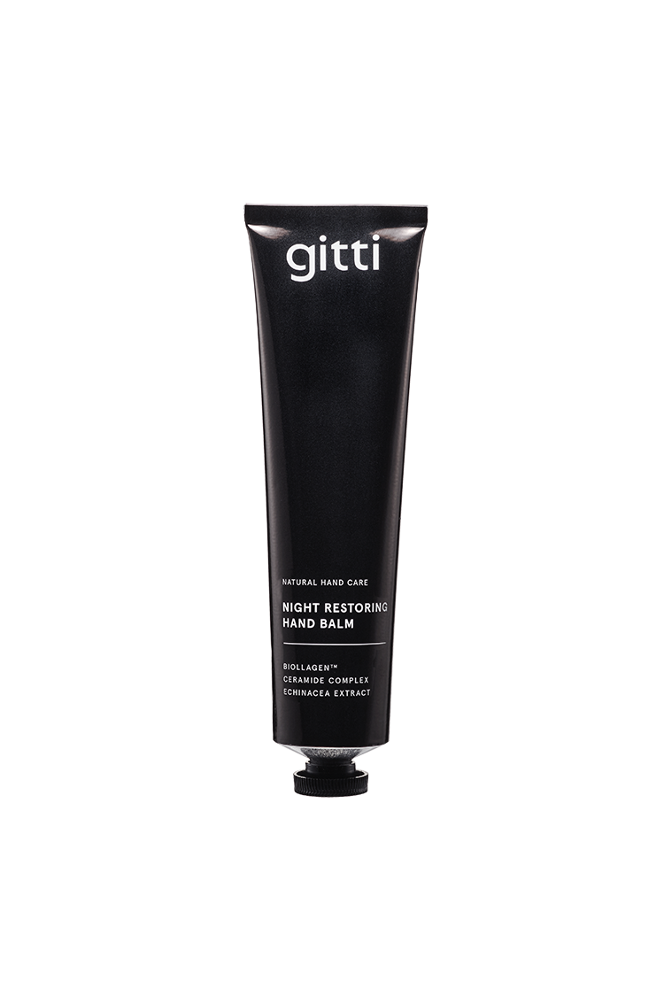Eine schwarze Tube mit der Aufschrift Night Restoring Hand Balm, ideal für die Nachtpflege mit Bio-Mandel- und Echinacea-Komplex - perfekt für verwöhnte Hände und Liebhaber von Handcreme.
