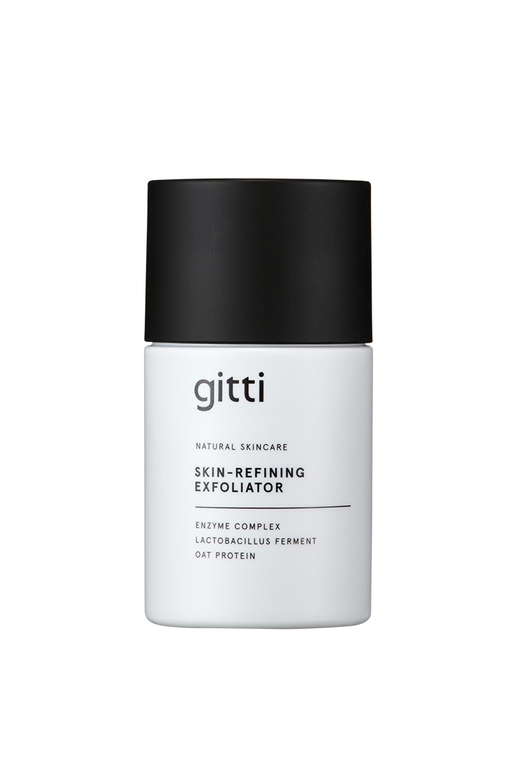 Ein weißes Fläschchen mit der Aufschrift Skin-Refining Exfoliator und einer schwarzen Kappe, in dem ein Enzymkomplex, Lactobacillus-Ferment und Haferprotein enthalten sind - ideal als Enzym-Peeling zur sanften Reinigung und als Peeling-Maske.