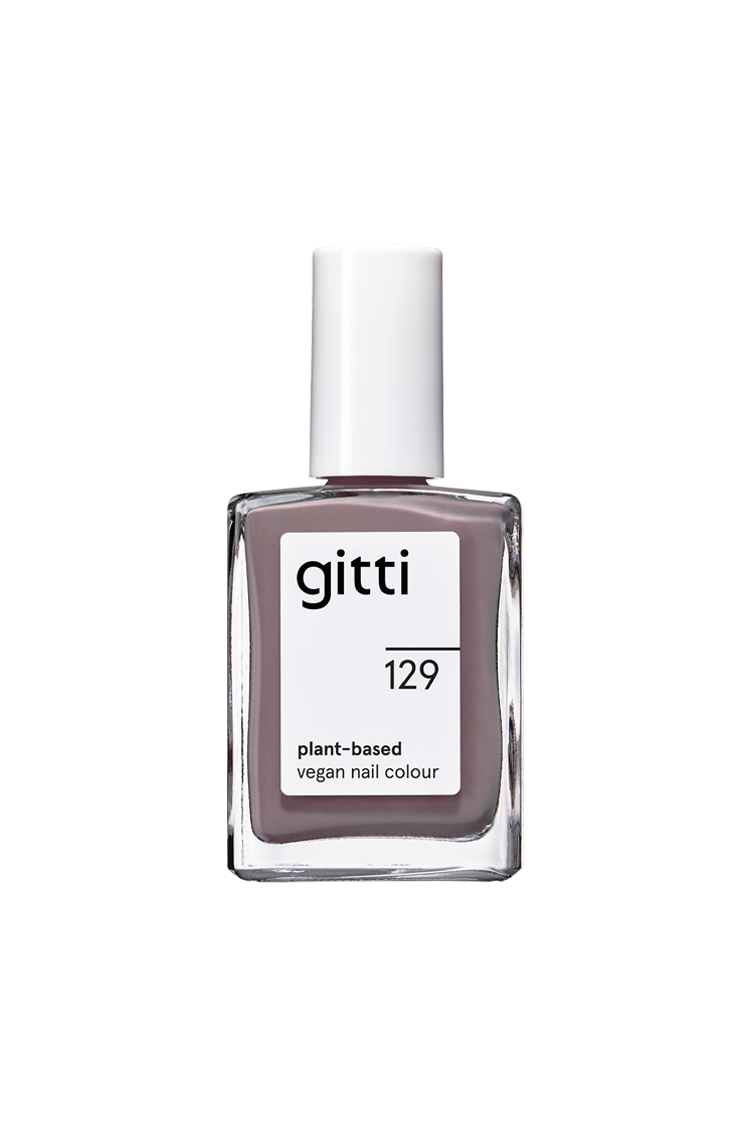 Eine Klarglasflasche mit gitti no. 129 pflanzliche vegane Nagelfarbe in Grau-Violett, mit weißem Verschluss und Etikett - eine elegante Wahl für einen modernen Look.