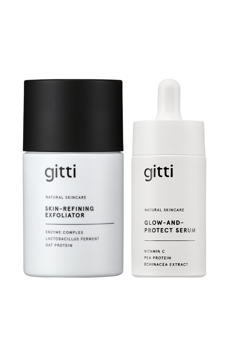 Entdecken Sie das Ultimate Glow Duo: ein Skin-Refining Exfoliator in einem eleganten Tiegel mit schwarzem Deckel und ein Glow-and-Protect Serum in einer eleganten weißen Tropfflasche - perfekt für eine strahlende, gesunde Haut.