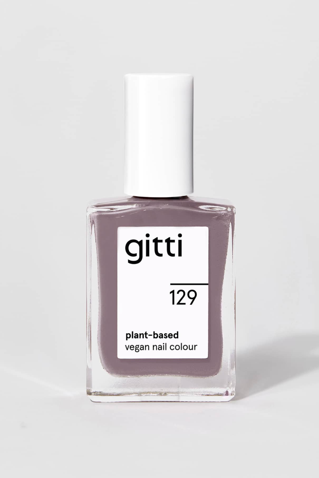 Gitti no. 129 ist eine vegane Nagelfarbe auf pflanzlicher Basis mit weißer Kappe und einem hellen mauvefarbenen Lack, der eine elegante Note in einem modernen grau-violetten Farbton verleiht.
