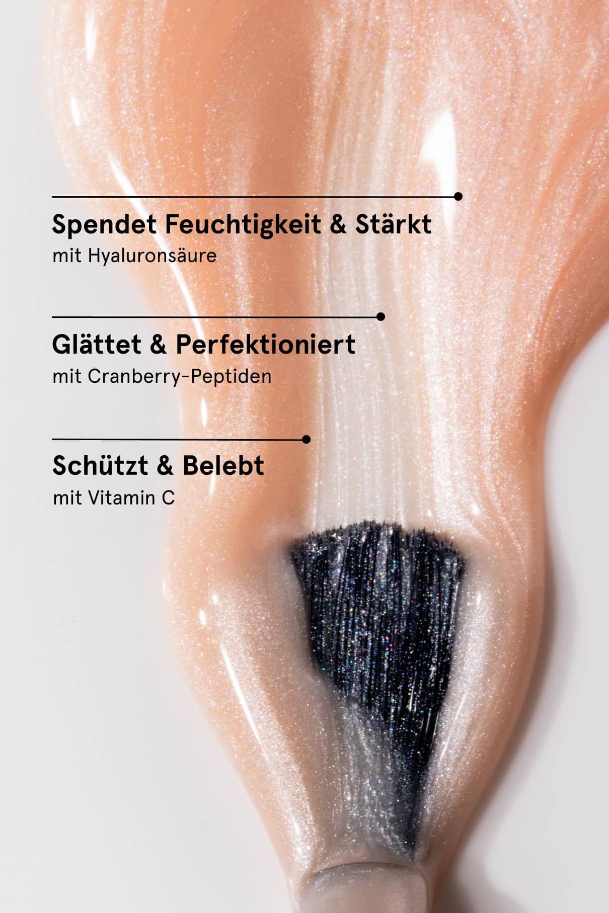 Macro shot of a glittery peach nail with a brush underneath and benefit text overlay.