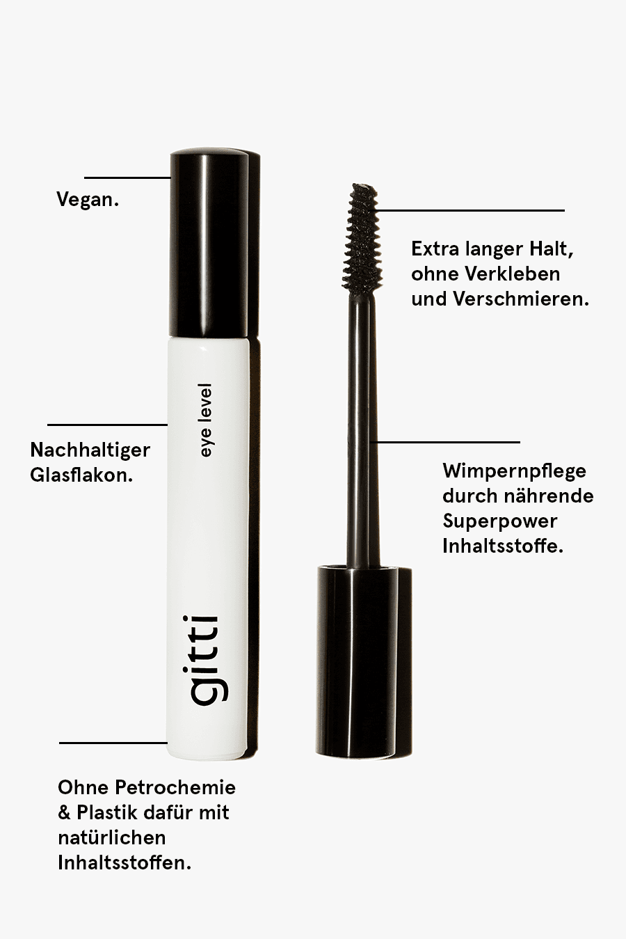 Eine weiß-schwarze Mascara-Tube mit der Aufschrift gitti, bei der der Zauberstab freiliegt; der deutsche Text hebt vegane, nachhaltige und natürliche Eigenschaften hervor - passt perfekt zu Ihrem Lash, Lip & Cheek Trio oder als Teil eines Mascara-Sets.